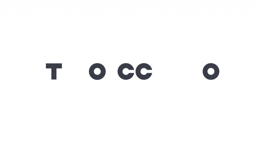 The image shows the word "TOCCO" in bold, black letters on a light gray background, with the individual letters spaced far apart. In the MaxBrain style, the two Cs have gaps, creating a minimalist and modern look.